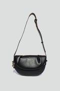 Fleur Half Moon Faux Leather Crossbody Bag in Black