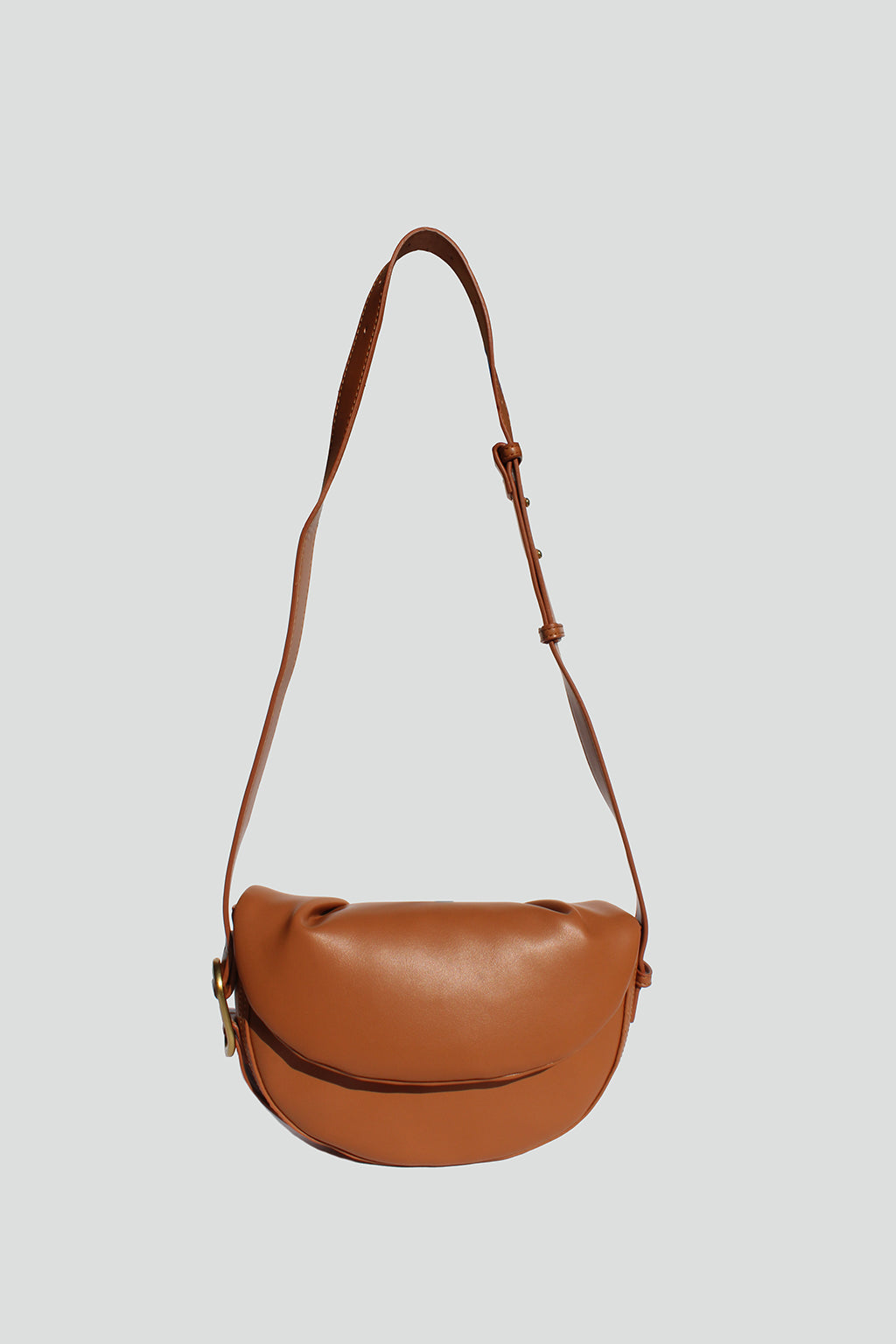 Fleur Half Moon Faux Leather Crossbody Bag in Tan